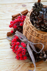 Wooden christmas basket with pine cones