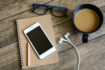 Cup of coffee with notebook