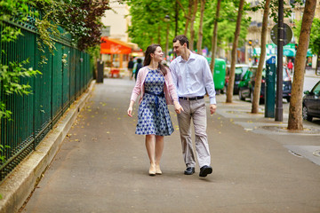 Dating couple is walking in Paris