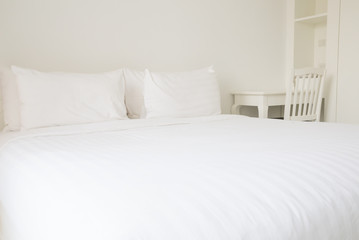 White bed sheets and pillows