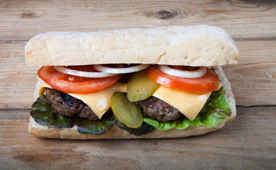 Homemade sandwich on wooden table