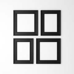 four blank black photo frames on white wall