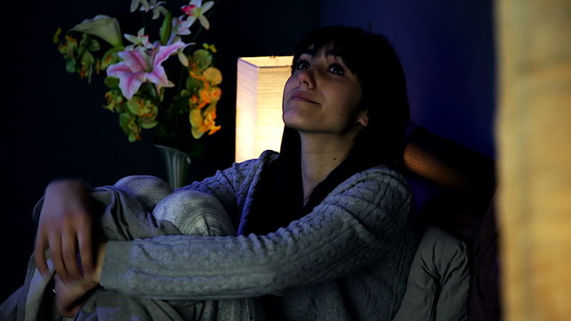 Beautiful sad woman starting to cry in bed medium shot
