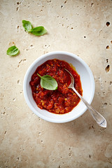 Chili pepper and garlic pesto in a small dish