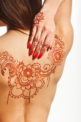 naked back of young girl with henna mehendi - 77896945