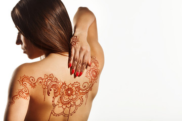 naked back of young girl with henna mehendi - 77896955