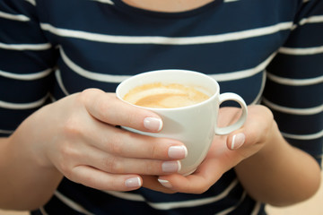 cup of coffee in hand