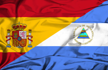 Waving flag of Nicaragua and Spain