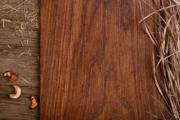 Empty wooden rustic board with straw, free copy space for text