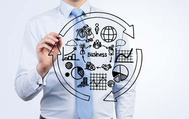 businessman drawing business scheme