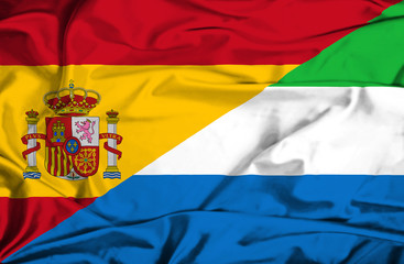 Waving flag of Sierra Leone and Spain