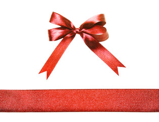 Red fabric ribbon and bow isolated on a white background