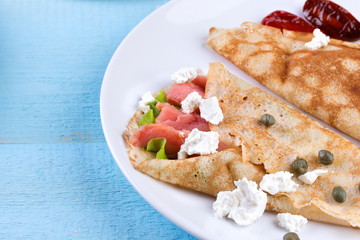 Thin pancakes, crepes with salmon