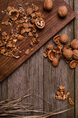 Walnuts on rustic wooden background copy space for text