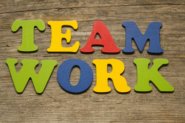 word Teamwork on a wooden background