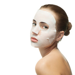 Young woman with beauty mask on her face.