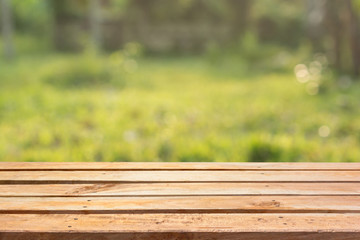 Fototapeta premium Empty wooden deck table on natural background