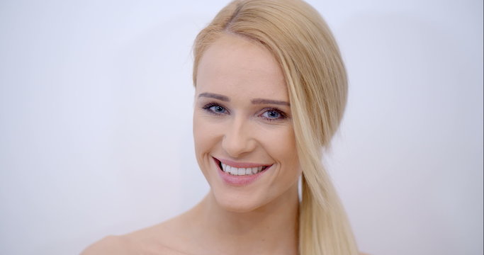 Smiling Face of Blond Woman Looking at Camera