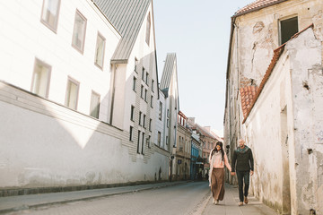 Young couple walking in the city in a day