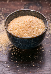 brown sugar heap and wooden spoon 