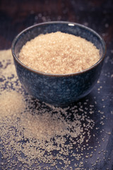 brown sugar heap and wooden spoon 
