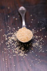 brown sugar heap and wooden spoon 