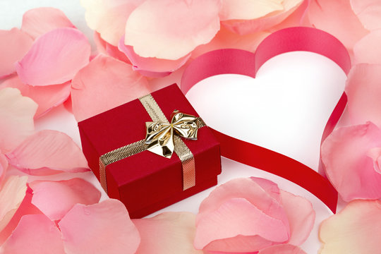 rose petals, heart and valentine present box background