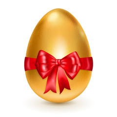 Golden easter egg with red bow