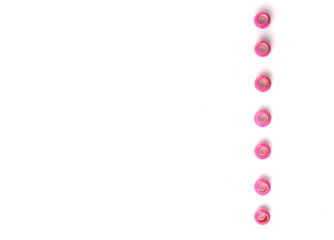 Pink round wooden beads over white background