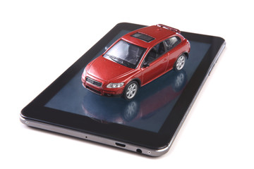 red toy car on tablet