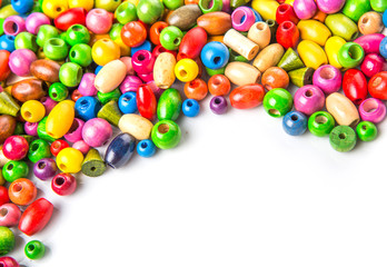 Colorful wooden beads on white background