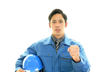 ガッツポーズの労働者