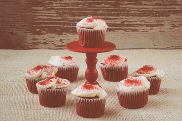 Cupcake on stand with rustic backgound