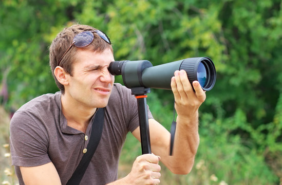 Man who is watching in spotting scope.