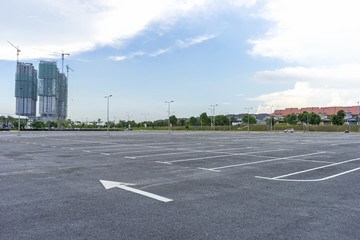 Empty parking lot with construction background © mawardibahar