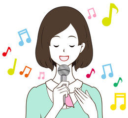 女性　歌う　目を閉じる