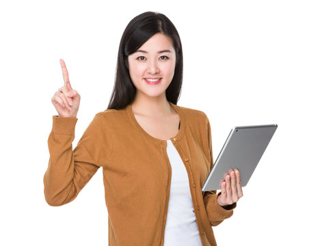 Woman use of tablet and funger point up