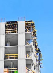 Building construction site work against blue sky