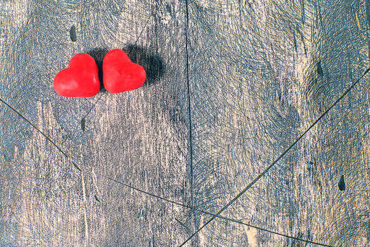 Candy hearts on wooden background