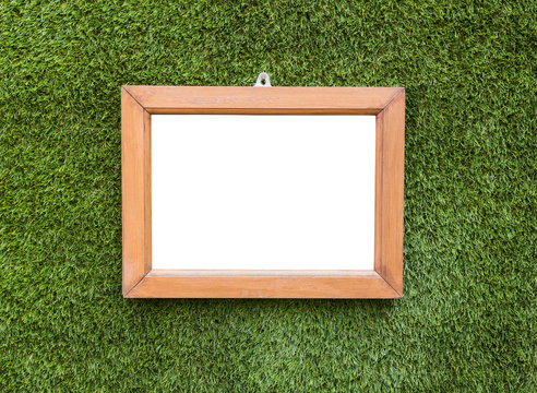 Picture frame hangings on artificial grass