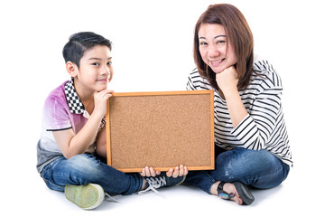 Asian mother and son hold wood board on white background