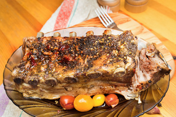 barbecued grilled ribs seasoned with hot spices and tomatoes