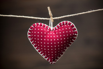Colorful fabric hearts on wood backgrounds