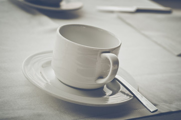 Coffee Cup on Table in Vintage Film Style
