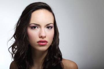 Fototapeta premium Indoor fashion portrait of beautiful young woman