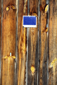 Wood planks with blue sign