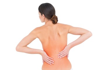 Rear view of a fit topless young woman with back pain