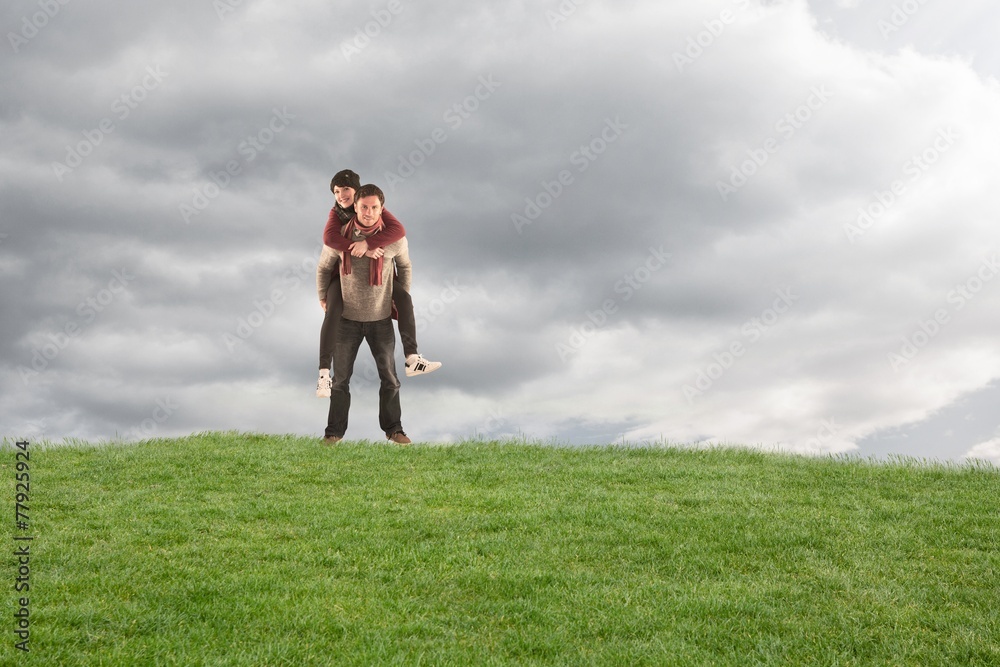 Poster composite image of man giving girlfriend piggy back