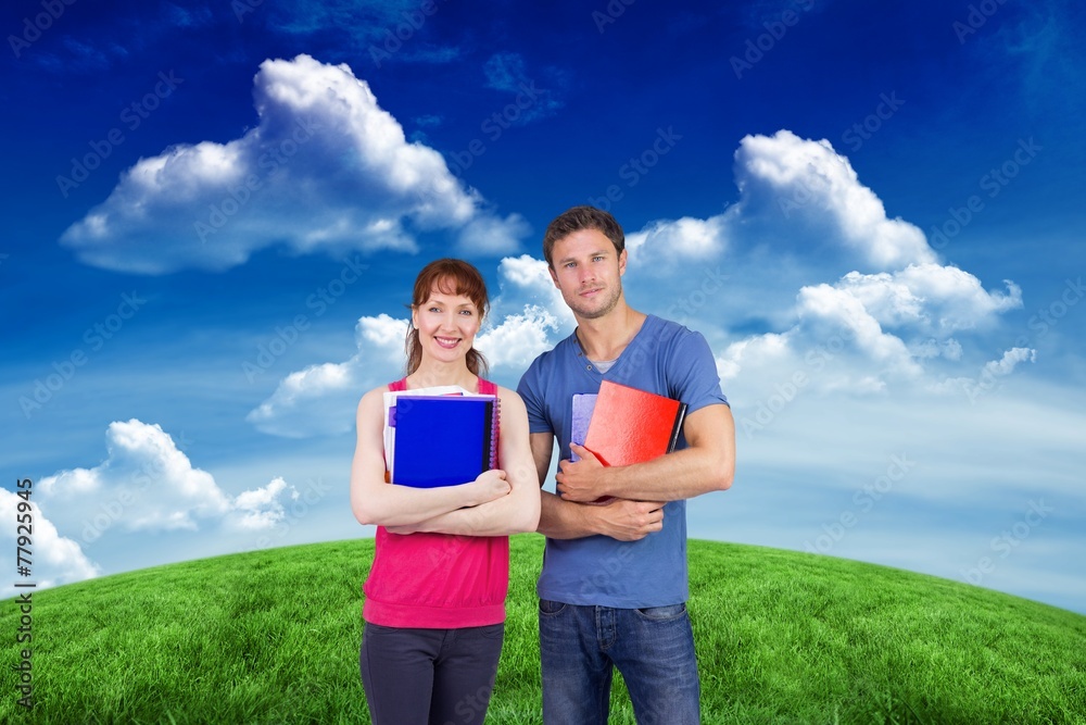Aufkleber Composite image of two students both with notepads
