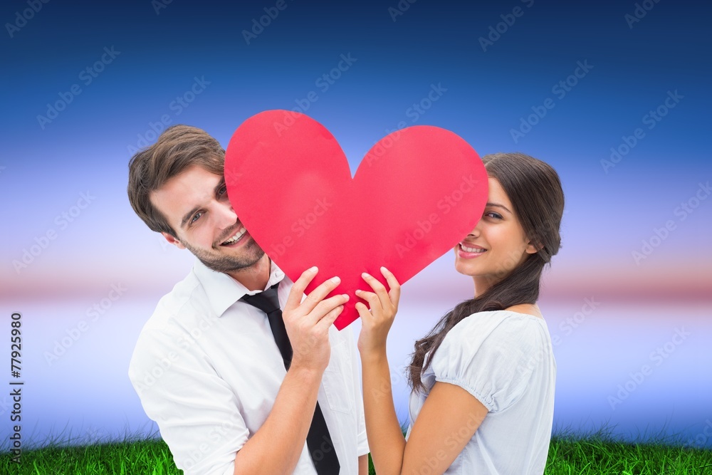 Poster composite image of couple smiling at camera holding a heart